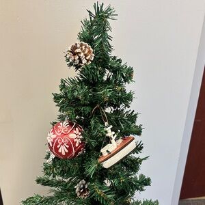 Festive Red Ornament with Pine Cones